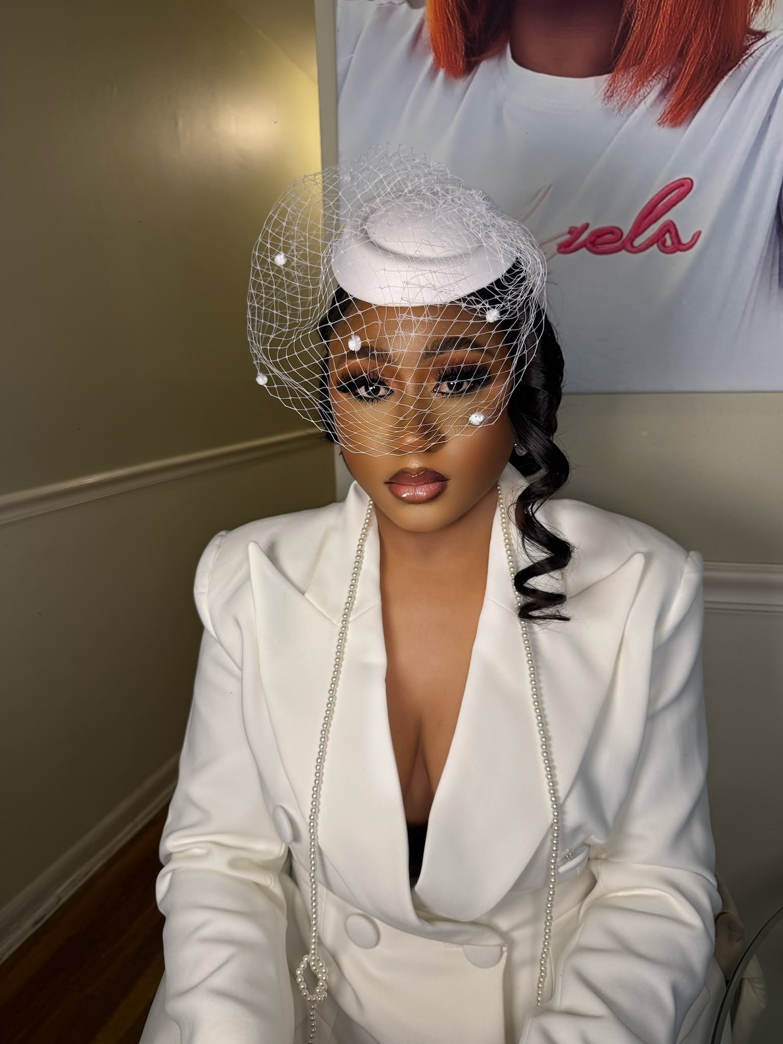 Bridal glam makeup with birdcage veil
